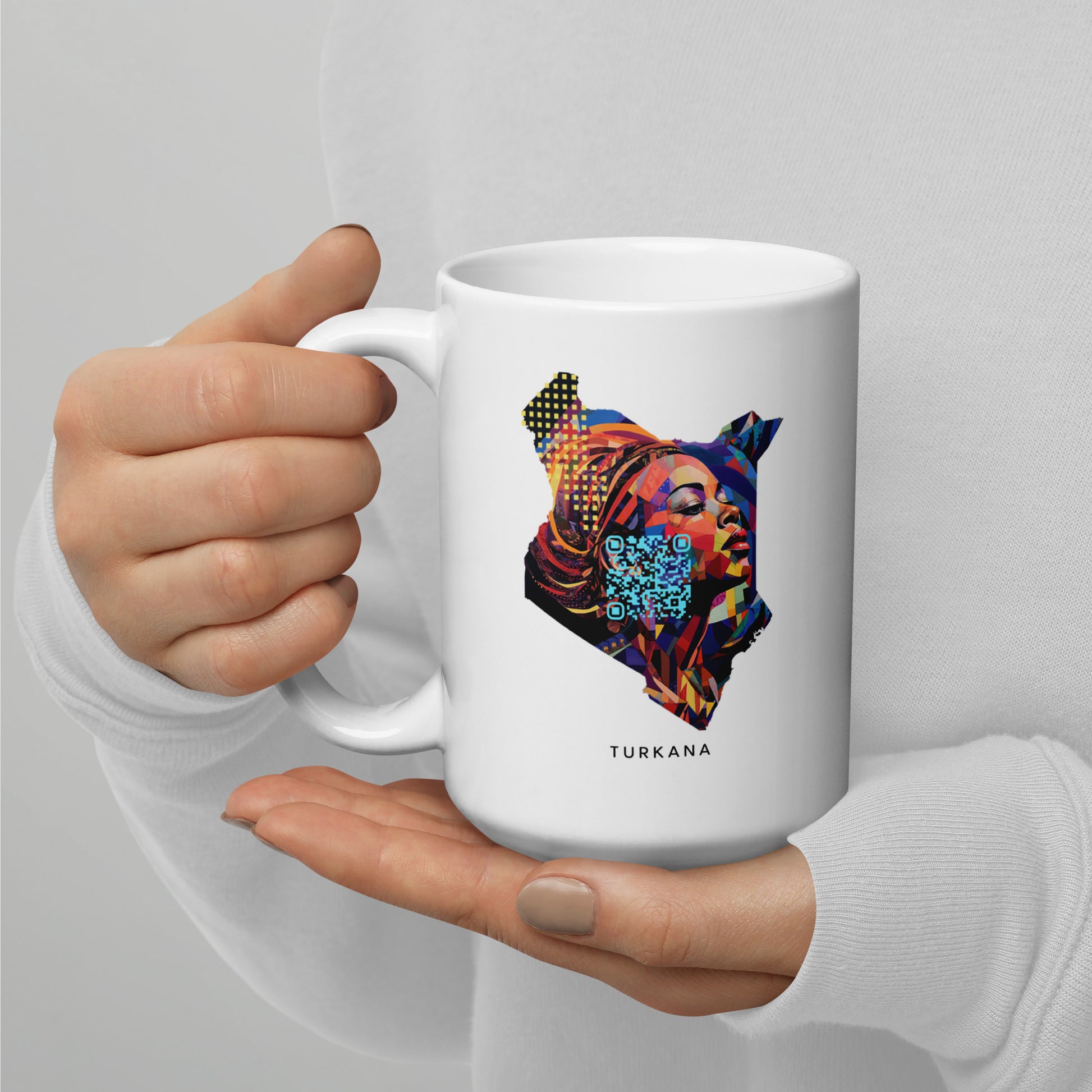 Discover the Turkana Mug - 15oz, featuring a colorful Teton-inspired design with the map of Africa. This surreal masterpiece, drawing inspiration from surreal animal hybrids and various art forms, celebrates Africa's rich cultural diversity. Ideal for those who appreciate unique and artful mugs.